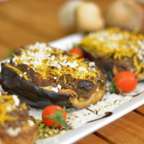 A close up image of mushroom stuffed aubergines