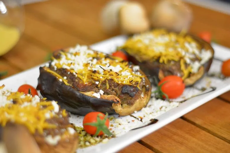 A close up image of mushroom stuffed aubergines