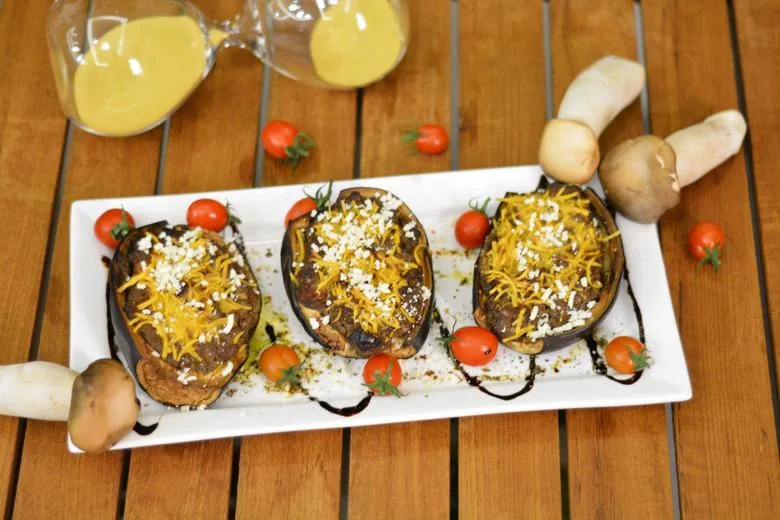 A close up image of mushroom stuffed aubergines