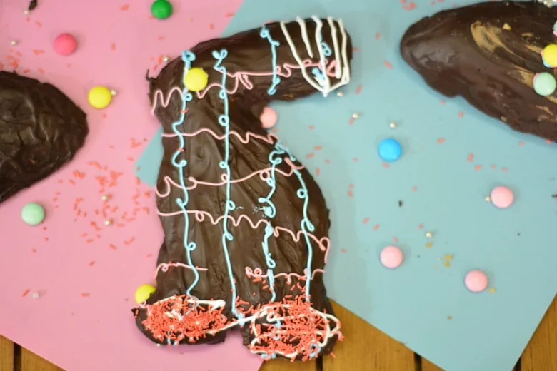A Maltese rabbit shaped almond cookie decorated with colorful icing