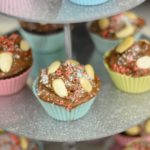 Healthy Vegan Chocolate Cupcakes coated in frosting and nuts