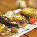 A close up image of mushroom stuffed aubergines